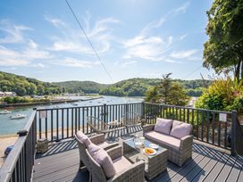 An outdoor seating area overlooking a river at Overdale