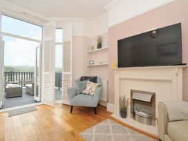 A living room with a sofa and television at Overdale