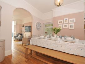 A dining room with a table set for a meal at Overdale