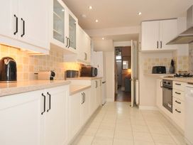 A kitchen with appliances and cabinetry at Overdale