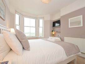 A bedroom with a bed and a television at Overdale