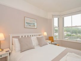 A bedroom with a bed and window view at Overdale