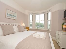 A bedroom with a bed and a dresser at Overdale