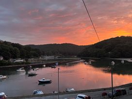 A river with boats during sunset at Overdale in Looe