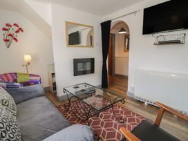 A living room with a sofa and coffee table at Ysgoldy in Dolwyddelan