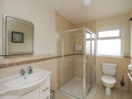A bathroom with a sink, shower, and toilet at Dunbrody Dreams