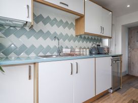 A kitchen with a sink and appliances at Sea Boots in Newquay