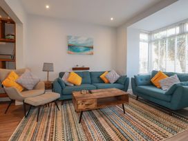 A living room with sofas and a coffee table at Sea Boots in Newquay