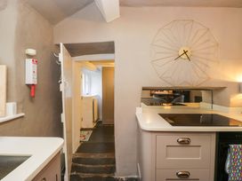 A kitchen with a countertop and a door at Two Hollens in Ambleside