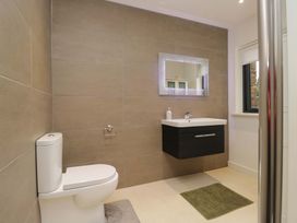 A bathroom with a toilet and sink at Two Hollens in Ambleside