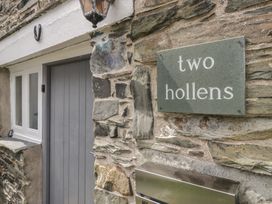 Entrance with stone wall and door at Two Hollens in Grasmere