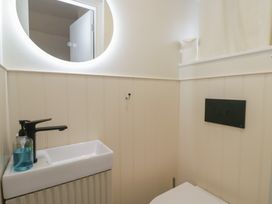 A bathroom with a sink and toilet at Two Hollens in Grasmere