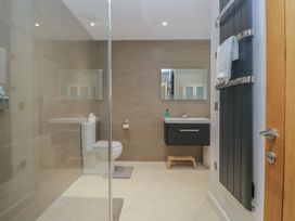 A bathroom with a toilet and wash basin at Two Hollens in Grasmere