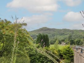 A view of a mountain and trees at Two Hollens in Grasmere