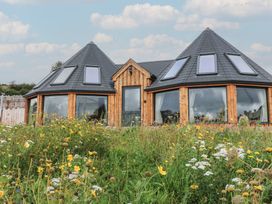 A house with a triangular roof and garden at Yr Awen in Lampeter