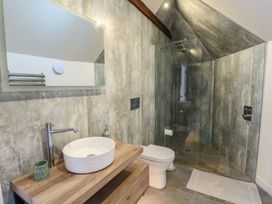 A bathroom with sink, toilet, and shower at Yr Awen in Lampeter