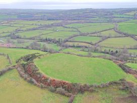 A view of fields and hills in the countryside near Lampeter