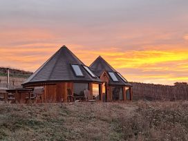 A house with a deck and windows at Yr Awen - Inspiration near Lampeter