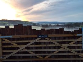A gate with a sign at Yr Awen near Lampeter