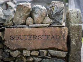 A stone sign displaying the name Souterstead at Souterstead in Torver near Coniston