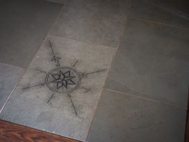 A floor featuring a compass rose in slate at Souterstead in Torver near Coniston