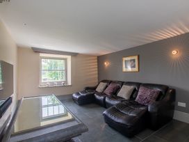 A living room with a sofa and coffee table at Souterstead in Torver near Coniston