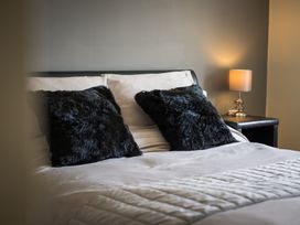 A bedroom with a bed and pillows at Souterstead in Torver near Coniston