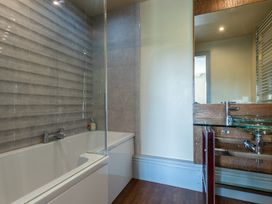 A bathroom with a bathtub and sink at Souterstead in Torver near Coniston