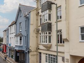 A street view of buildings with windows and a lamp post at Home by the Harbour Dartmouth