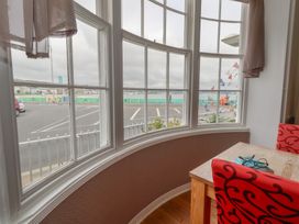 A dining room with a view of the sea at 9 The Esplanade 