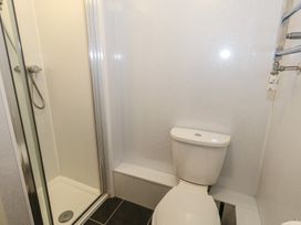 A bathroom with a shower and a toilet at 9 The Esplanade
