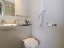 A bathroom with a sink and toilet at 9 The Esplanade