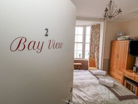 A bedroom with bed and television at 9 The Esplanade