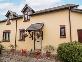 A front view of a cottage with planters at Ocean Cottage in Bude