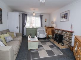 A living room with a sofa and coffee table at Ocean Cottage in Bude