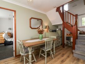 A dining room with a table and chairs at Ocean Cottage in Bude