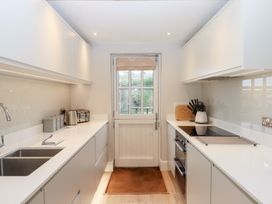 A kitchen with a sink and appliances at 3 Keepers Cottage