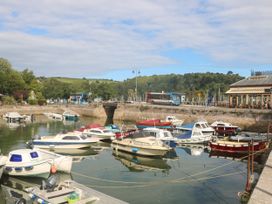 A view of boats in the water at the harbor near 3 Keepers Cottage in 