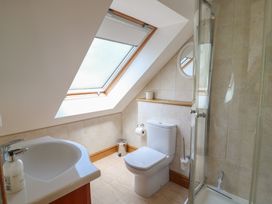 A bathroom with a sink, toilet, and shower at 3 Keepers Cottage, Hillfield Village