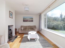 A living room with a sofa and coffee table at Tapps Lodge, Brixton near Yealmpton, South Devon