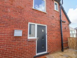 A door and window on a brick wall at Floraville