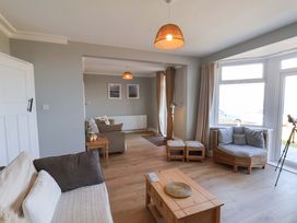 A living room with a sofa and coffee table at Floraville