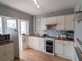 A kitchen with cabinets and appliances at Floraville
