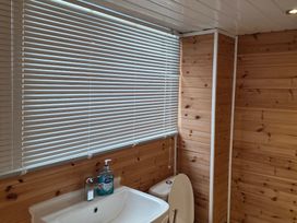A bathroom with a sink and toilet at Floraville Cayton Bay