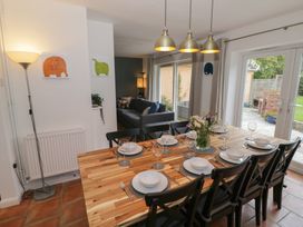 A dining room with a table set for dinner at Harran in Pershore