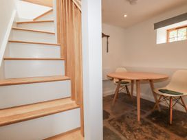 A dining area with a table and chairs at The Old Dairy