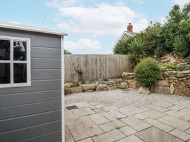 An outdoor area with a shed and gravel space at The Old Dairy