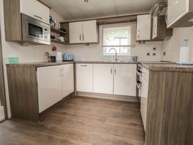 A kitchen with cabinets and appliances at Delta Superior in 