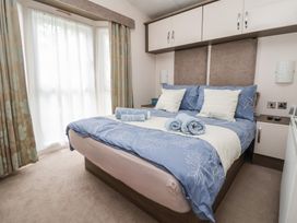 A bedroom with a bed and curtains at Delta Superior