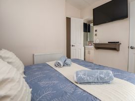 A bedroom with a bed and television at Delta Superior 